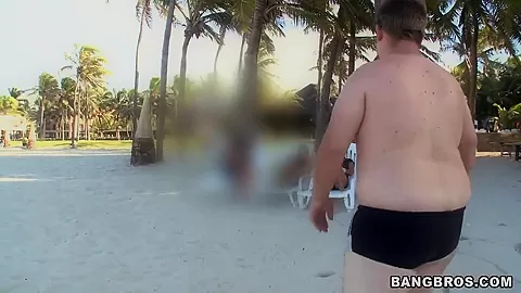 Two horny guys walking along Brazilian beach