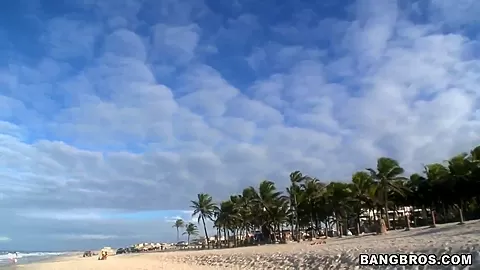 Two horny guys walking along Brazilian beach