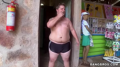 Two horny guys walking along Brazilian beach