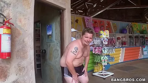 Two horny guys walking along Brazilian beach