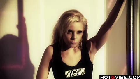 Hot blonde works the stripper pole