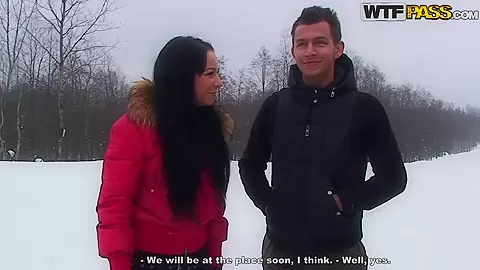 A couple spends a romantic day at a ski lodge