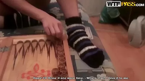 Russian girl Nastya and her classmate playing backgammon