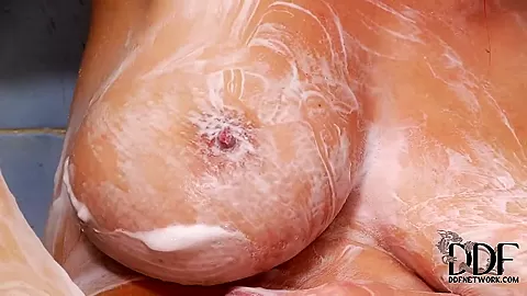 Busty redhead Vanessa polishes twat under shower