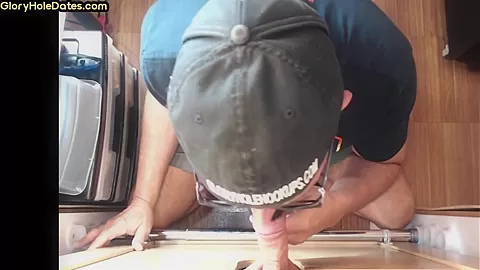 Gloryhole gay enjoys jerking big dick while sucking it