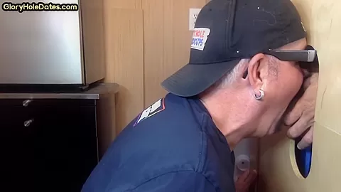 Gloryhole gay enjoys jerking big dick while sucking it