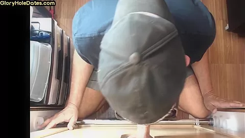 Gloryhole gay enjoys jerking big dick while sucking it
