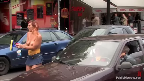 Flexible redhead is bound and stripped naked in public