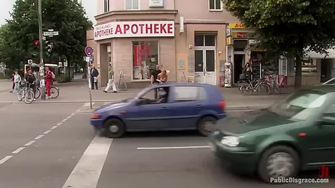 Flexible redhead is bound and stripped naked in public
