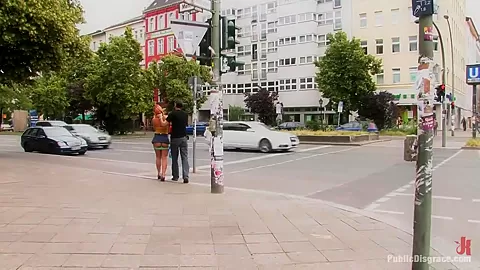 Flexible redhead is bound and stripped naked in public