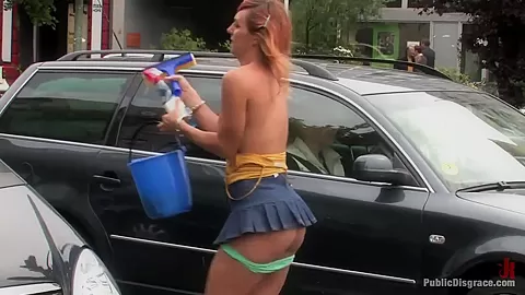 Flexible redhead is bound and stripped naked in public