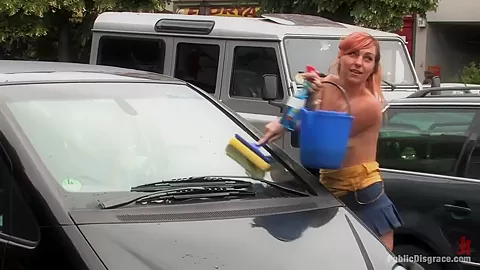 Flexible redhead is bound and stripped naked in public