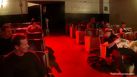 Slinky slut gives it up in an adult movie theater