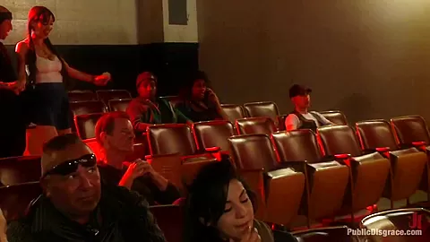 Slinky slut gives it up in an adult movie theater