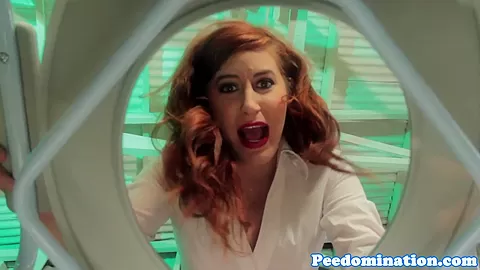 Redhead mistress teases sub with drops of pee