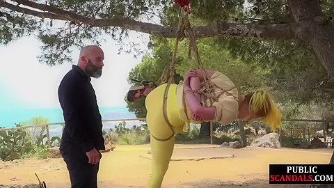 Femsub used in public suspension bondage with spanking