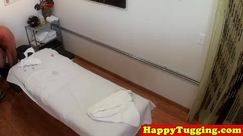 Asian masseuse jerking and riding on client