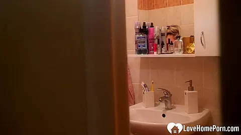 Solo blonde babe in the shower pleasures herself