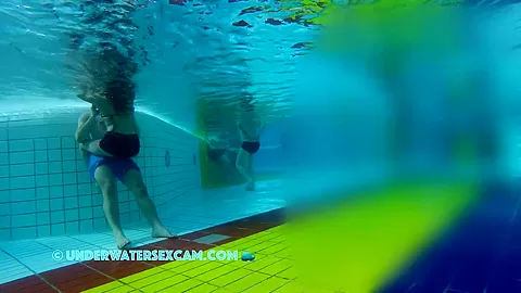 He Puts His Hands Under Her Swimming Trunks And Massages Her Ass