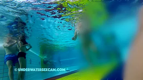 He Puts His Hands Under Her Swimming Trunks And Massages Her Ass