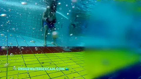 He Puts His Hands Under Her Swimming Trunks And Massages Her Ass