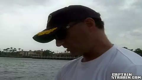 A innocent redhead sucks two dicks at sea
