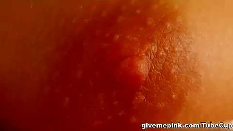 A cute brunette oils up and spreads her pink pussy lips.