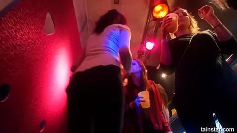 Lesbian pornstars licking their cunts in a club