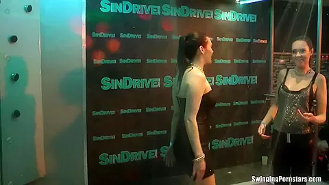 Wet girls dancing erotically in a club
