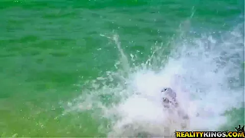 Sexy and young couple spend time near the water in beautiful place