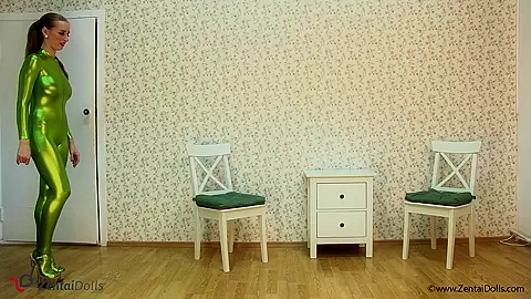 Spineless Lady In Shiny Green Catsuit - Watch4Fetish