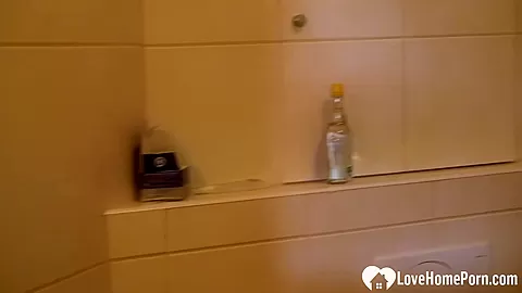 Beauty in the shower pleasures herself quietly