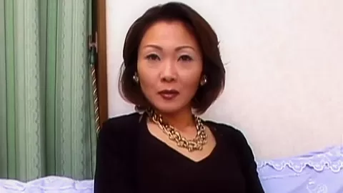 Solo asian MILF enjoys masturbation