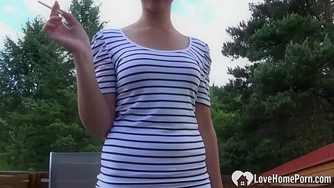 Beauty smokes before she masturbates outdoors on cam