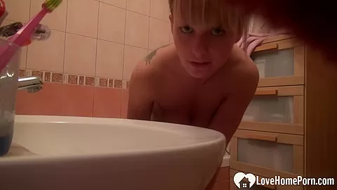 Cute blonde masturbates during her hot shower