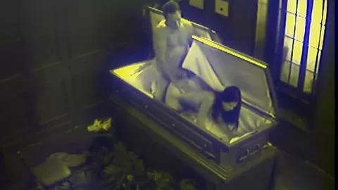 Slut fucks in massive coffin