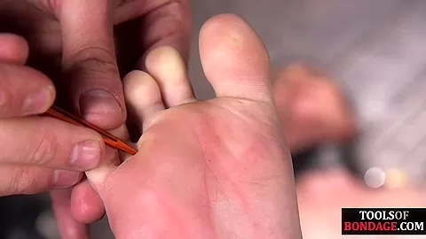 Bondage sub foot dominated in duo while in kink dungeon