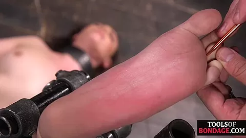 Bondage sub foot dominated in duo while in kink dungeon