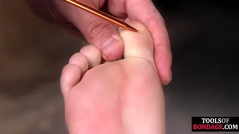 Bondage sub foot dominated in duo while in kink dungeon