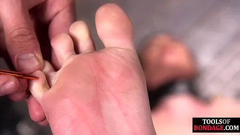 Bondage sub foot dominated in duo while in kink dungeon
