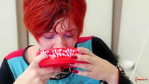 Flogged BDSM submissive drinks lube