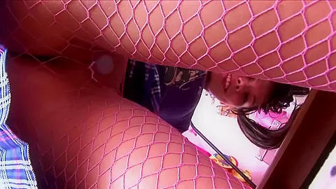 Pigtailed brunette in sexy pink fishnet pantyhose
