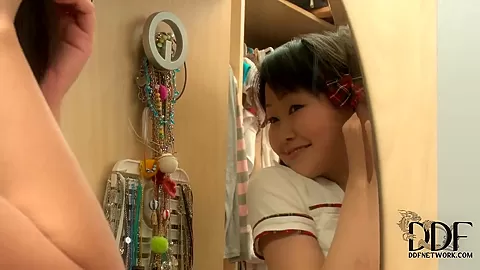Super cute Asian Aliona dressing up in front of the camera