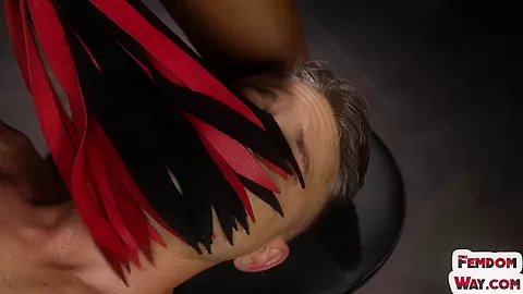 BDSM ebony femina teases perverted male while whipping him