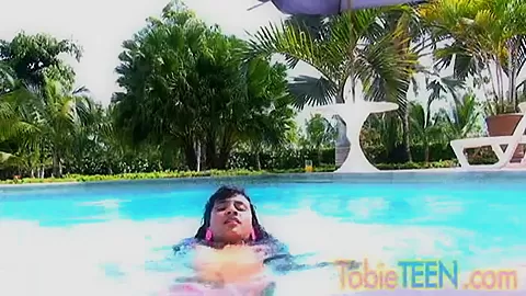 Tobie teen 18+ masturbates by the pool
