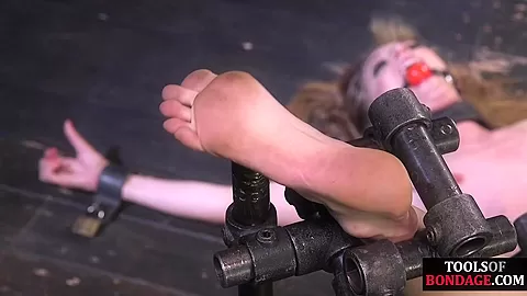 Whipped BDSM submissive MILF with ballgagged mouth suffers