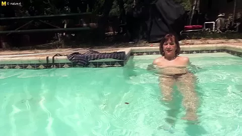 Horny Mature Lady Fooling Around With Her Pussy At The Pool - MatureNL