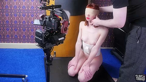 Blindfolded redhead slavegirl gagging cock