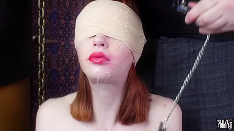 Blindfolded redhead slavegirl gagging cock