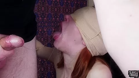Blindfolded redhead slavegirl gagging cock